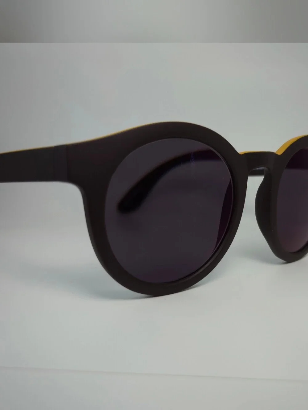 Oasis. Men's Black Round Frame. Deep Chocolate, Yellow Top.